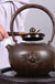 Cast Iron Embroidered Teapot Boiling Water